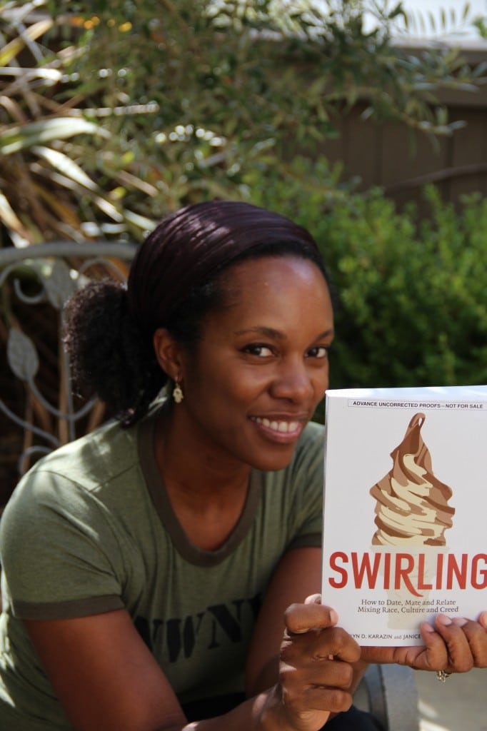 Author Christelyn Karazin holding 