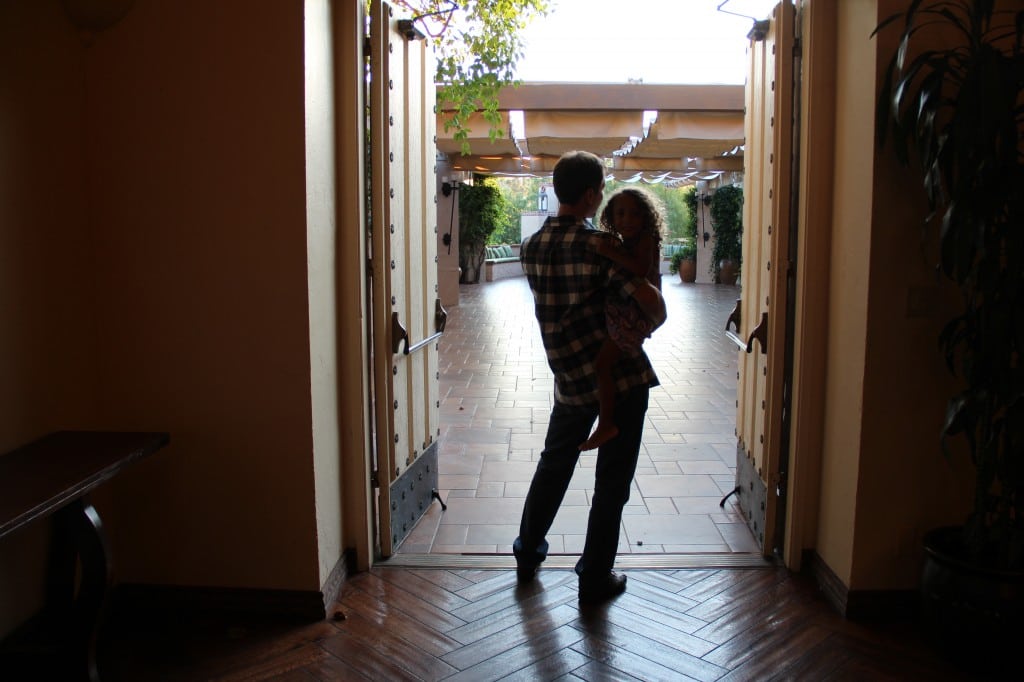 Mike and Emma are looking out to an upstairs patio often used for small parties