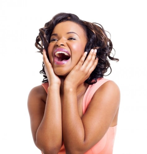 cute african american woman laughing on white background
