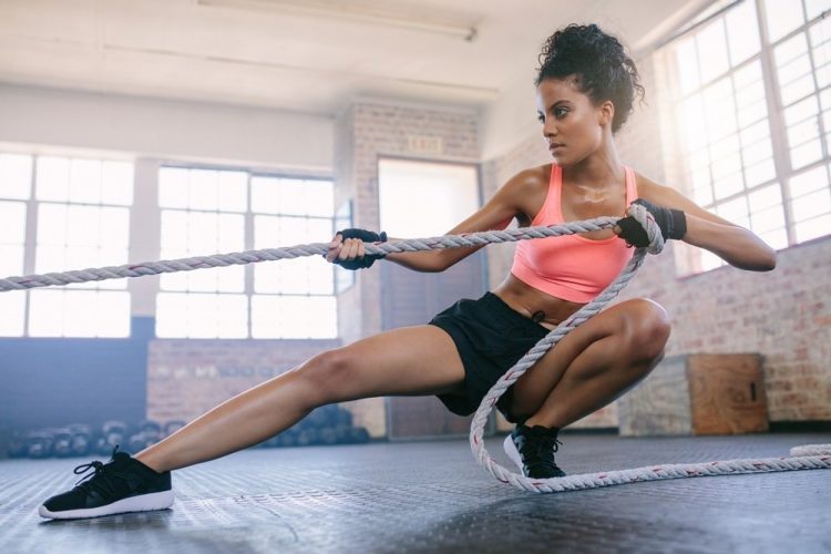 black woman working out in a gym